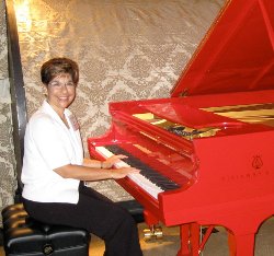 Gail Berenson trying out a RED grand piano at Steinway Hall, New York City.